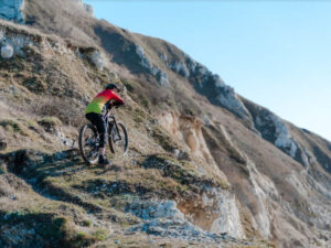 Mountain bikers satisfied after conquering the mountain slope