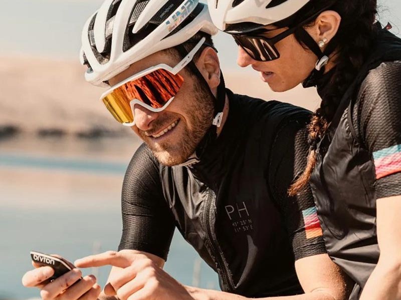 The cycling couple is learning how the cyclo-computer works