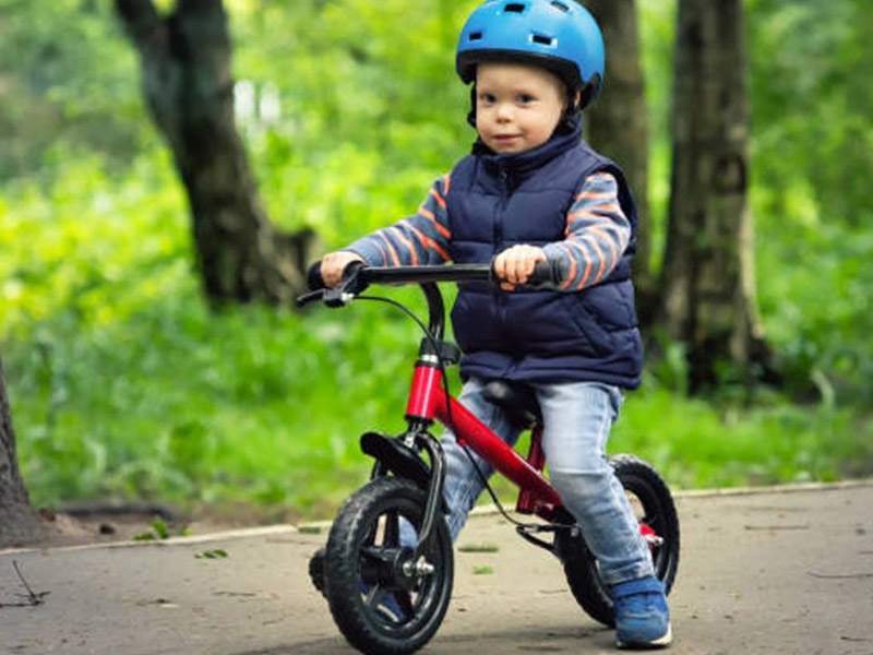 Riding a push bike in the peaceful park