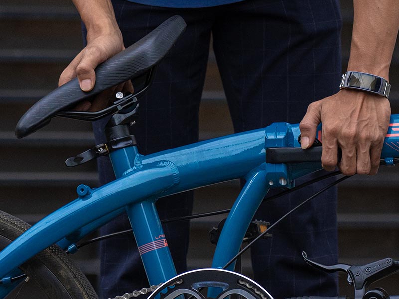 Folding a bike before storing it on the room