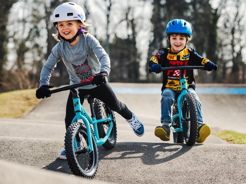 Riding a balance bike together with friends