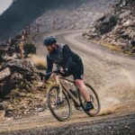 Polygon Tambora G7 gravel bike running through rugged trails