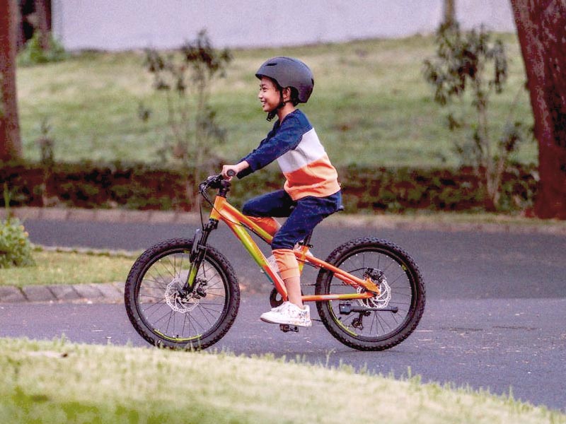 A standard pedal kids bike used to improve confidence